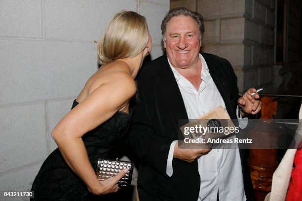 Gerard Depardieu and Angela Simon attend 'A Royal Affair' reception during the 74th Venice Film Festival at Pallazina G on September 5, 2017 in...
