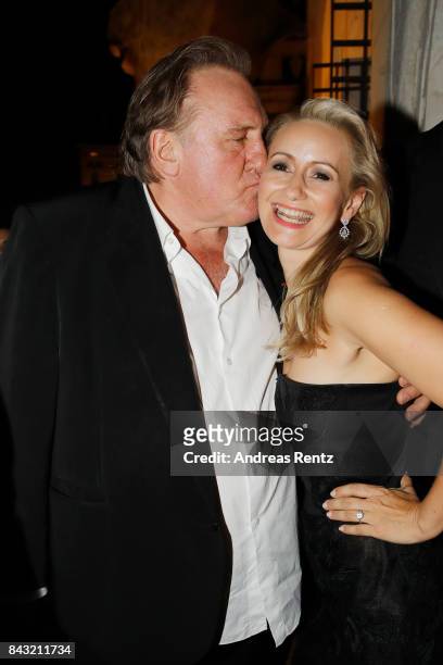 Gerard Depardieu and Angela Simon attend 'A Royal Affair' reception during the 74th Venice Film Festival at Pallazina G on September 5, 2017 in...