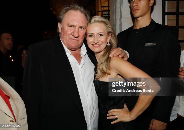 Gerard Depardieu and Angela Simon attend 'A Royal Affair' reception during the 74th Venice Film Festival at Pallazina G on September 5, 2017 in...