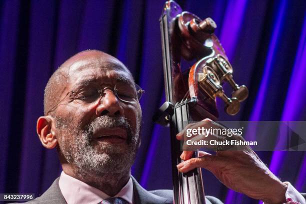 American Jazz musician Ron Carter plays upright bass, as he performs onstage at the Blue Note nightclub, New York, New York, July 13, 2017.