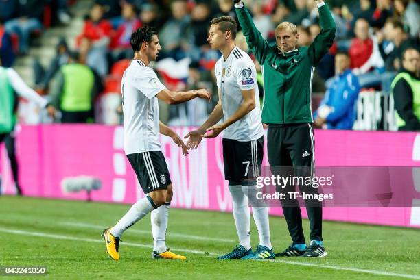 Lars Stindl of Germany shakes hands with Julian Draxler of Germany during the FIFA 2018 World Cup Qualifier between Czech Republic and Germany at...