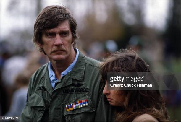 View of an unidentified Vietnam veteran and a woman at the Vietnam War Memorial dedication, Washington DC, November 13, 1982.