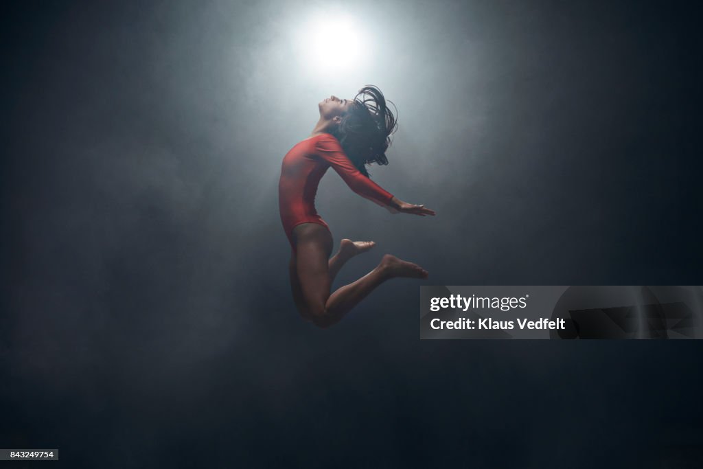 Gymnast doing jump in leotard