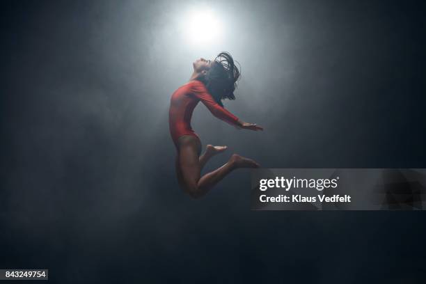 gymnast doing jump in leotard - women power stock pictures, royalty-free photos & images