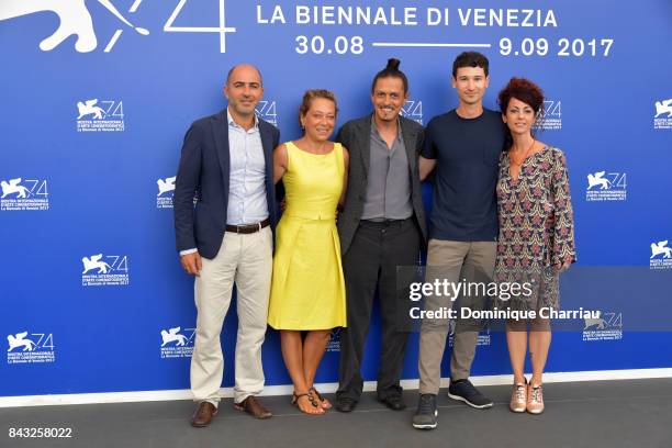 Paolo Manera, Paola Malanga, Simone Catania, Giovanni Totaro and guest attend the 'Happy Winter' photocall during the 74th Venice Film Festival on...