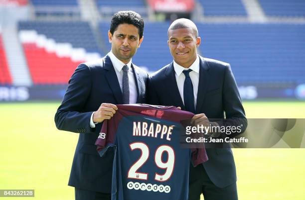 Kylian Mbappe is presented as new player of Paris Saint Germain by President of PSG Nasser Al Khelaifi at Parc des Princes on September 6, 2017 in...