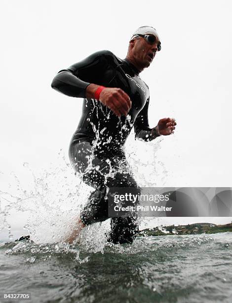 Mark Cockroft of New Zealand leaves the water after the swim leg during the Wanaka Challenge January 17, 2009 in Wanaka, New Zealand.