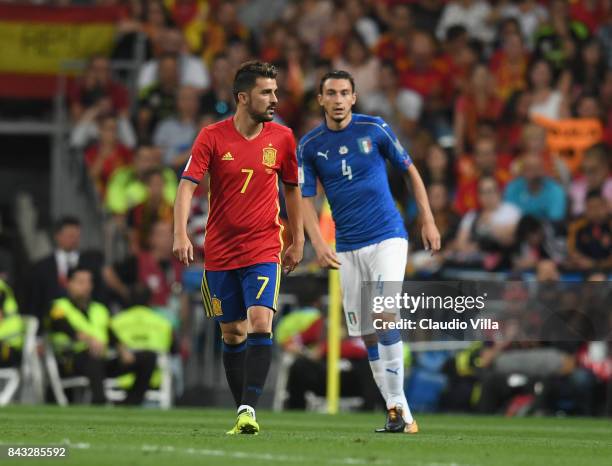 Matteo Darmian of Italy and David Villa of Spain look on look on during the FIFA 2018 World Cup Qualifier between Spain and Italy at Estadio Santiago...