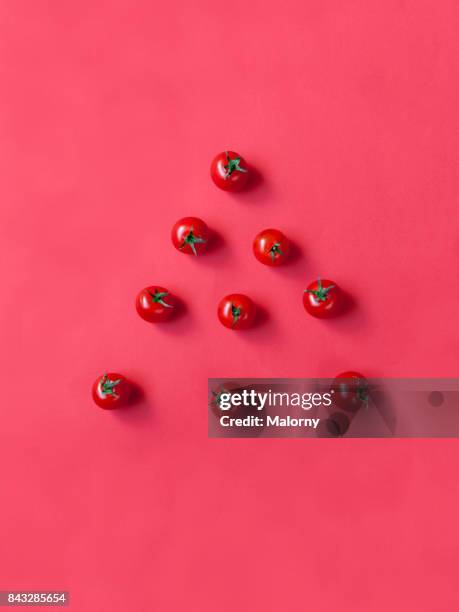 Tomatoes on bold red background. Bold Colours