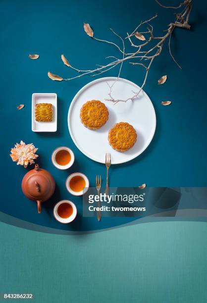 flat lay mid-autumn festival food and drink still life. - mooncake stock pictures, royalty-free photos & images