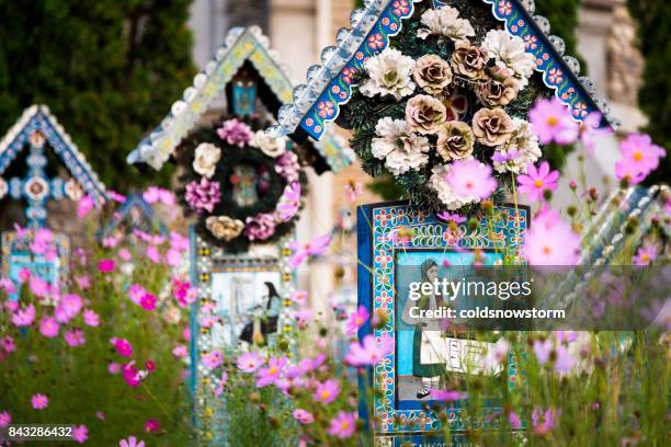 gravestones at the merry cemetery in sapanta, romania - maramureș stock pictures, royalty-free photos & images