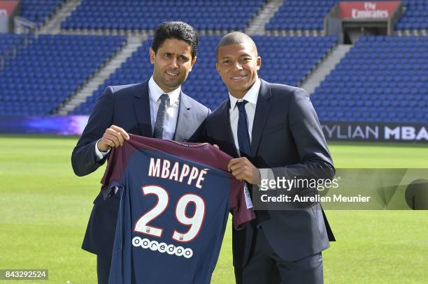 Paris Saint-Germain President Nasser Al Khelaifi poses alongside new signing Kylian Mbappe at the Parc des Princes on September 6, 2017 in Paris,...