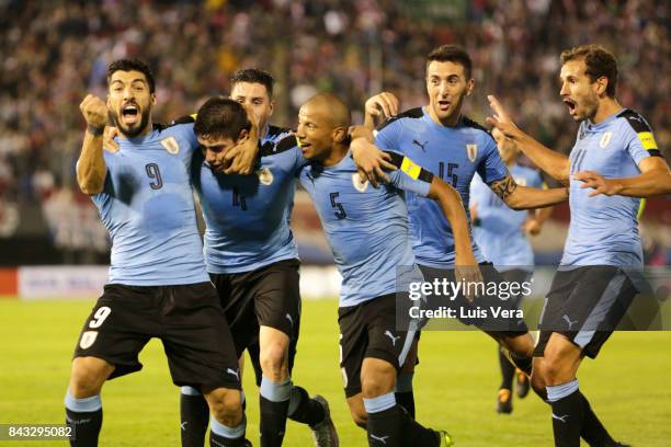 Federico Valverde of Uruguay celebrates with teammates Luis Suarez, Carlos Sanchez, Matias Vecino and Christian Stuani after scoring the first goal...