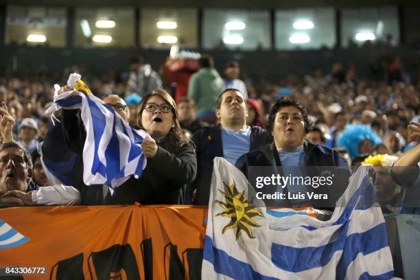 Fans of Uruguay cheer for their team during a match between Paraguay and Uruguay as part of FIFA 2018 World Cup Qualifiers at Defensores del Chaco...