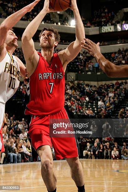 Andrea Bargnani of the Toronto Raptors drives against Jeff Foster of the Indiana Pacers at Conseco Fieldhouse on January 16, 2009 in Indianapolis,...