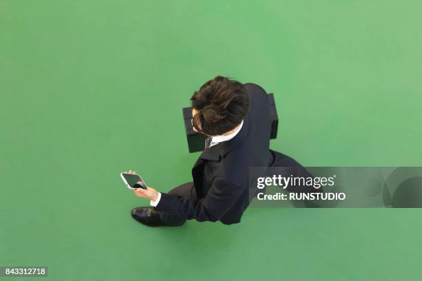 top view of businessman holding cell phone - business man walking with a bag in asia bildbanksfoton och bilder