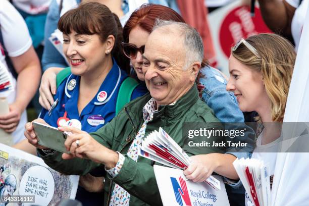 Actor and television presenter Sir Tony Robinson takes a selfie with protesters during a protest against a Government pay cap on September 6, 2017 in...