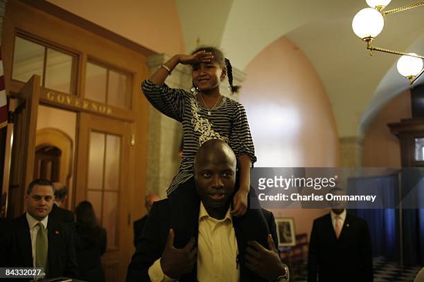 Democratic presidential nominee U.S. Senator Barack Obama's daughter, Sasha Obama plays with aide Reggie Love backstage before a campaign rally at...