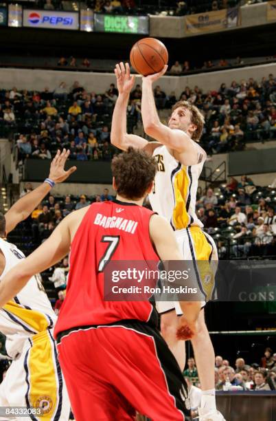 Troy Murphy of the Indiana Pacers shoos over Andrea Bargnani of the Toronto Raptors at Conseco Fieldhouse on January 16, 2009 in Indianapolis,...