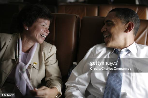 Democratic presidential candidate U.S Senator Barack Obama , and senior advisor Valerie Jarrett chat on their campaign plane June 21, 2008 en-route...