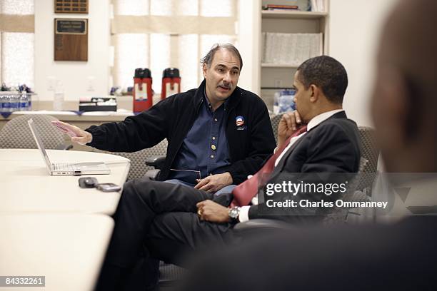 Democratic presidential candidate U.S. Senator Barack Obama huddles with his senior staff, David Axelrod and Robert Gibbs backstage before speaking...