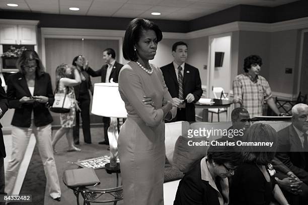 Democratic presidential hopeful U.S Senator Barack Obama 's wife Michelle Obama backstage before her husband's speech during a rally at the North...