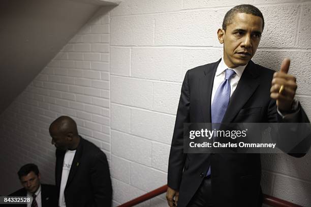 Democratic presidential hopeful U.S Senator Barack Obama and his wife Michelle Obama backstage before speaking during a rally at the North Carolina...