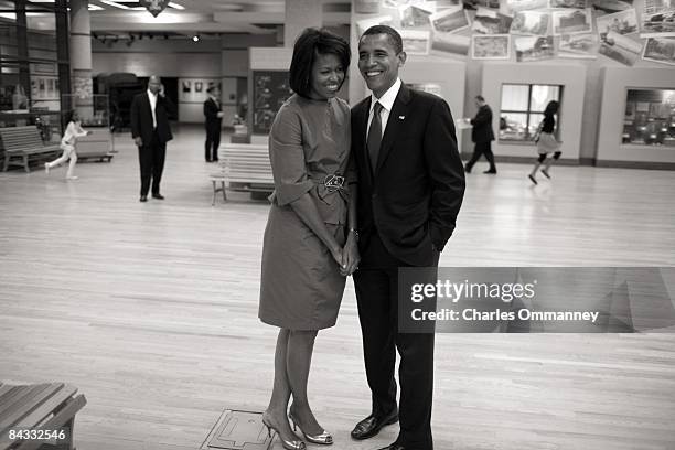 Democratic presidential hopeful U.S Senator Barack Obama , his wife Michelle Obama stand together backstage at a rally near the Iowa state capitol...