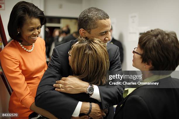 Democratic presidential hopeful U.S Senator Barack Obama and his wife Michelle Obama backstage before speaking during a rally at the North Carolina...