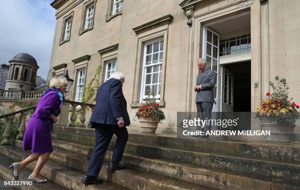 Britain's Prince Charles, Prince of Wales, waits to greet Ireland's President Michael D Higgins, and his wife Sabina Higgins, as they arrive at...