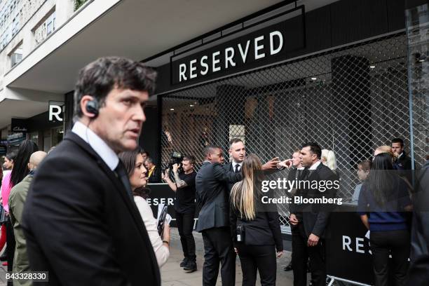 Security prepare for the arrival of British fashion model Kate Moss and the opening of London's first Reserved store, operated by LPP SA, on Oxford...