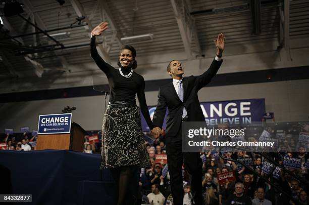 Democratic presidential hopeful U.S Senator Barack Obama and his wife Michelle Obama take the stage at a primary night rally in the gymnasium at the...