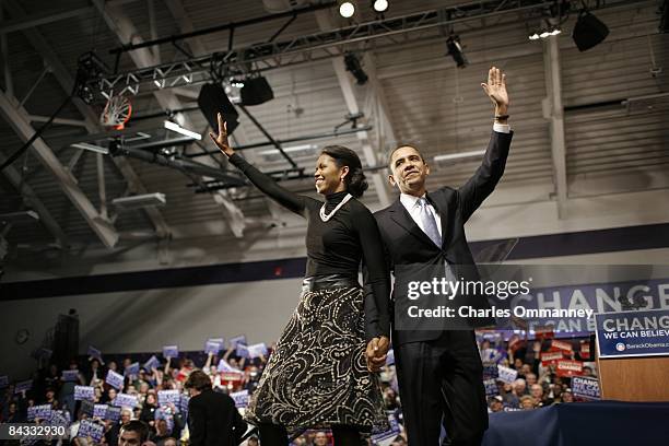 Democratic presidential hopeful U.S Senator Barack Obama and his wife Michelle Obama take the stage at a primary night rally in the gymnasium at the...