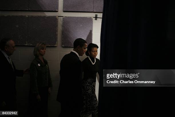 Democratic presidential hopeful U.S Senator Barack Obama and his wife Michelle Obama backstage before going out to face their supporters at a primary...