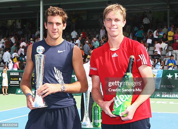 Juan Martin Del Potro of Argentina with the winners trophy next to runner up Sam Querrey of USA during day five of the Heineken Open at ASB Tennis...