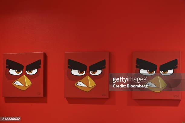 Artworks with the face of Angry Bird character 'Red' sit on display at the headquarters of Rovio Entertainment Oy in Espoo, Finland, on Wednesday,...