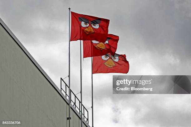 Flags with the face of Angry Birds character 'Red' fly outside the headquarters of Rovio Entertainment Oy in Espoo, Finland, on Wednesday, Sept. 6,...