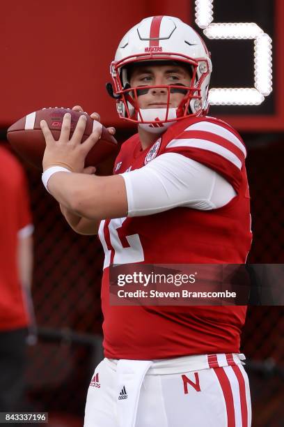 Quarterback Patrick O'Brien of the Nebraska Cornhuskers warms up before the game against the Arkansas State Red Wolves at Memorial Stadium on...