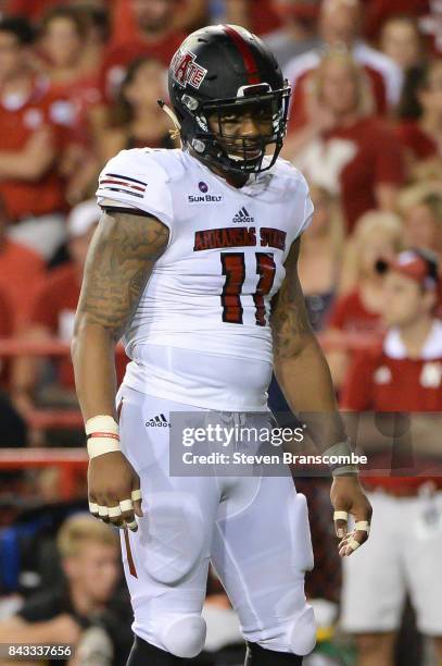 Defensive end Ja'Von Rolland-Jones of the Arkansas State Red Wolves awaits a snap against the Nebraska Cornhuskers at Memorial Stadium on September...