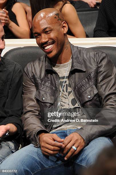 Stephon Marbury of the New York Knicks watches from courtside a game between the Orlando Magic and the Los Angeles Lakers at Staples Center on...