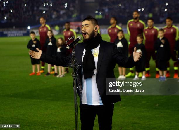 Ulises Bueno sings the National Anthem of Argentina before a match between Argentina and Venezuela as part of FIFA 2018 World Cup Qualifiers at...