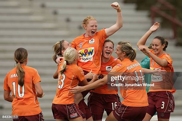 The Queensland Roar women celebrate victory after full time in the W-League 2009 Grand Final match between the Queensland Roar and Canberra United at...