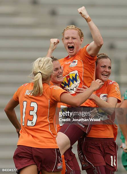 Clare Polkinghorne of the Roar celebrates victory with team mates after full time in the W-League 2009 Grand Final match between the Queensland Roar...