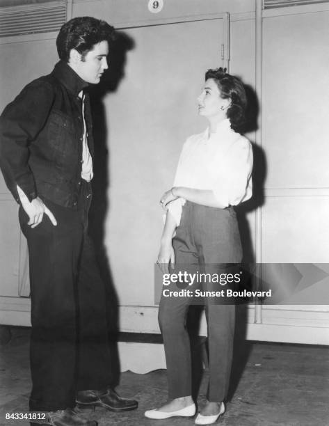 Jean Simmons with singer and actor Elvis Presley on the set of Jailhouse Rock directed by Richard Thorpe.