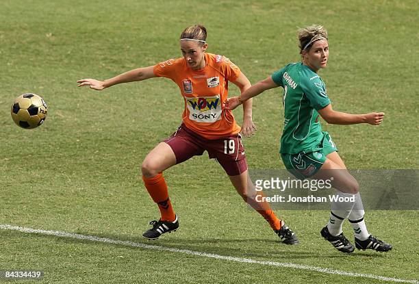 Ellen Beaumont of the Roar evades a tackle from Amy Chapman of Canberra during the W-League 2009 Grand Final match between the Queensland Roar and...