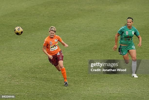 Courtney Beutel of the Roar pursues the ball with Thea Slatyer of Canberra during the W-League 2009 Grand Final match between the Queensland Roar and...