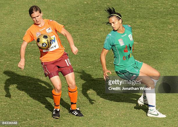 Lana Harch of the Roar controls the ball ahead of Thea Slatyer of Canberra during the W-League 2009 Grand Final match between the Queensland Roar and...