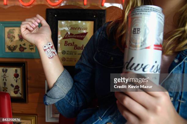 Music fans recieve temporary tattoos in the Bud Block area during 2017 Budweiser Made in America - Day 1 at Benjamin Franklin Parkway on September 2,...