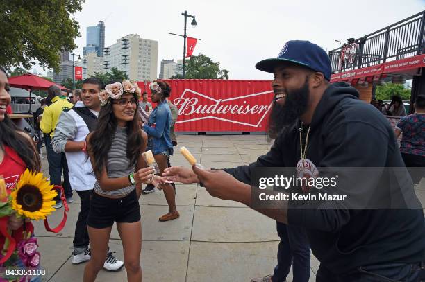 Music fans recieve popsicles in the Bud Block area during 2017 Budweiser Made in America - Day 1 at Benjamin Franklin Parkway on September 2, 2017 in...