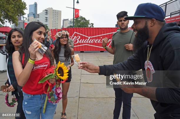 Music fans recieve popsicles in the Bud Block area during 2017 Budweiser Made in America - Day 1 at Benjamin Franklin Parkway on September 2, 2017 in...